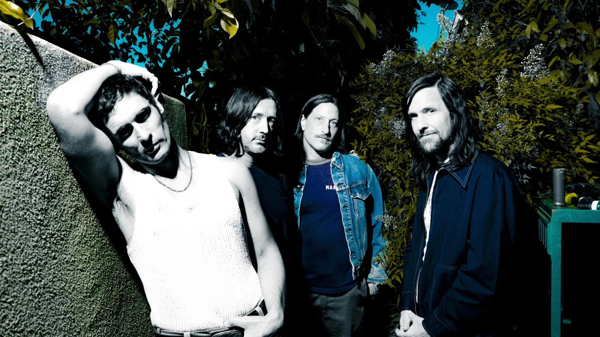 The All-American Rejects against a wall in the sun